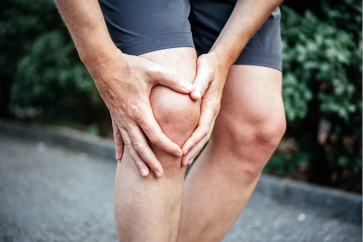 Person with knee pain from a meniscus tear